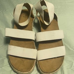 White Sandals. Cute and comfy. Very beachy look.